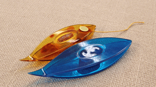 Two post tatting shuttles designed with a curved pointed tip — Clover and SKC — one partially wound with thread. Curved pointed tips help untie knots and make small lace adjustments easier.