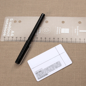 Plastic card with shuttle outline marked, ruler and fine marker