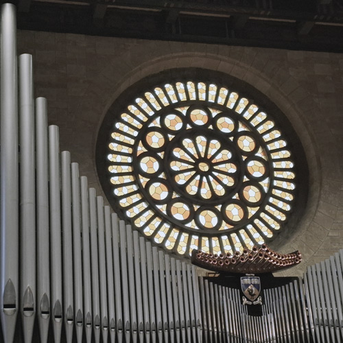 Rose window of Winthrop Hall at the University of Western Australia, symbolising symmetry and handcrafted beauty.